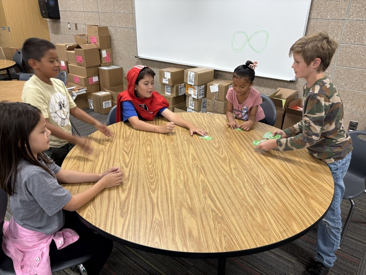 second and fifth grade buddies playing math games