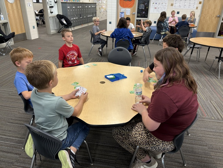 second and fifth grade buddies playing math games