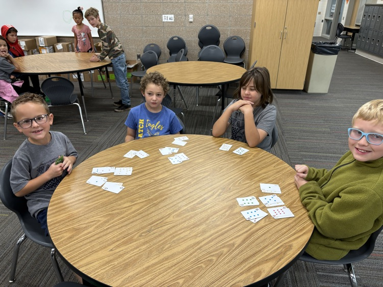 second and fifth grade buddies playing math games