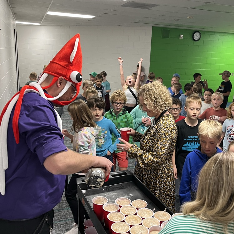 Our principal, Mr. Reid can be seen wearing one of his many “hats” and pouring root beer floats for every student.