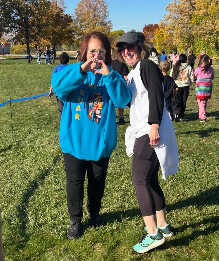 teachers posing while walking laps