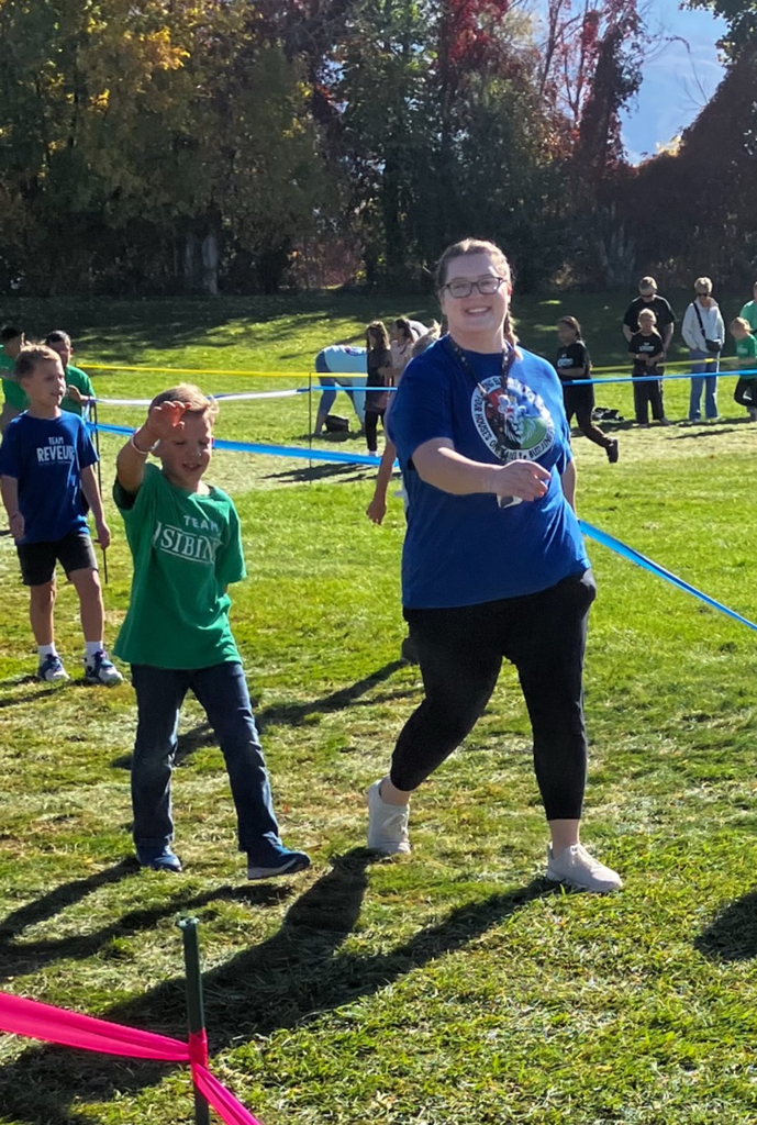 students and teachers walking laps