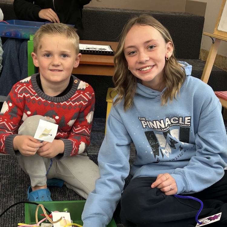 FFJH cheerleaders playing with elementary student
