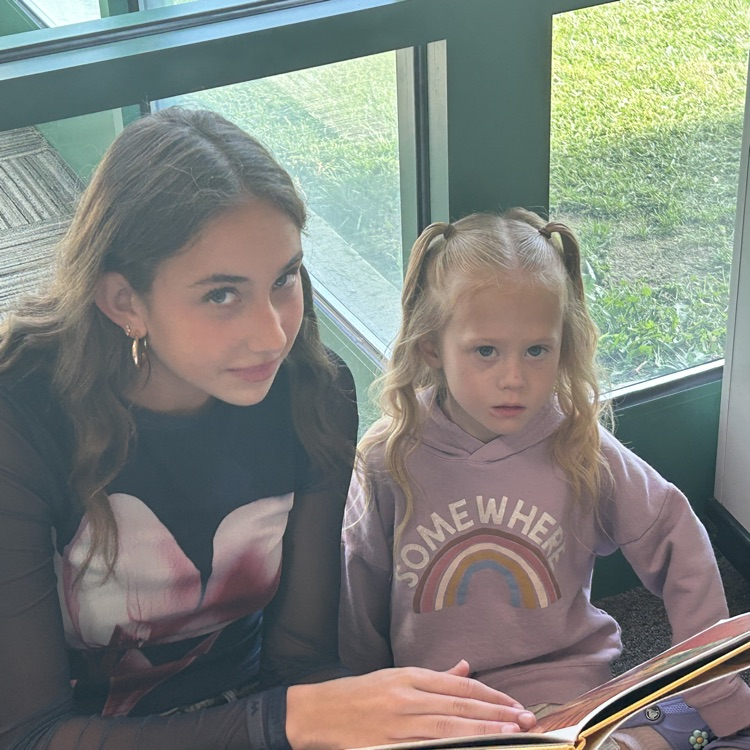 FFJH cheerleaders playing with elementary student