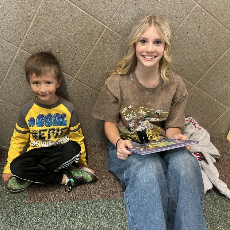 FFJH cheerleaders playing with elementary student