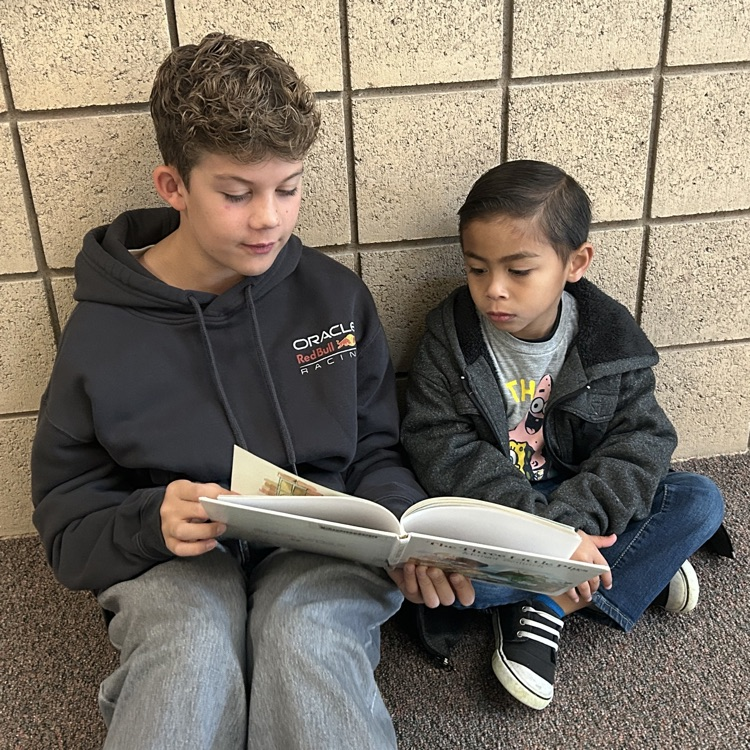 FFJH cheerleaders playing with elementary student