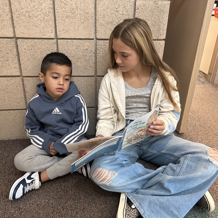 FFJH cheerleaders playing with elementary student