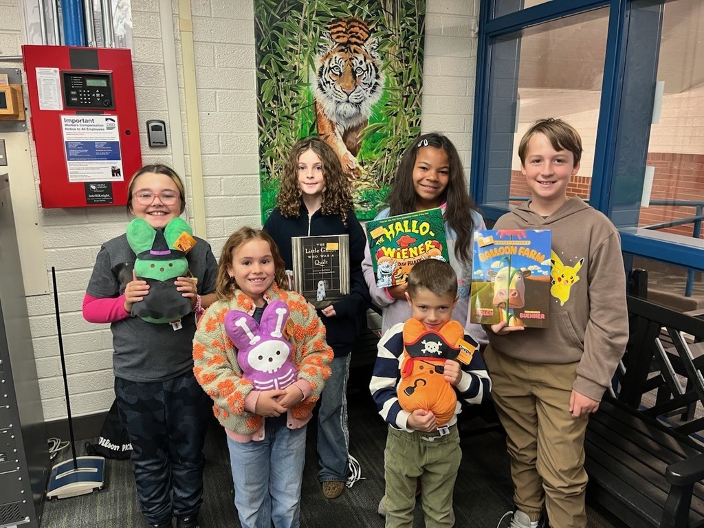 Students with their prizes from Principal Forbush from the trunk or treat