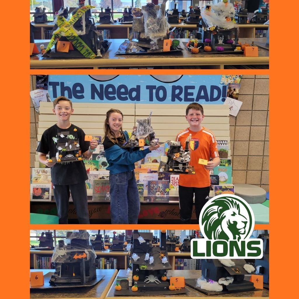 Students with Haunted Houses they created with paper and decorated with Halloween supplies.