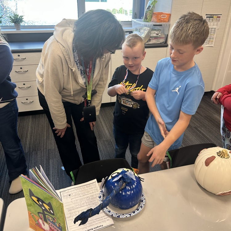 women listening to boy talk with another boy listens