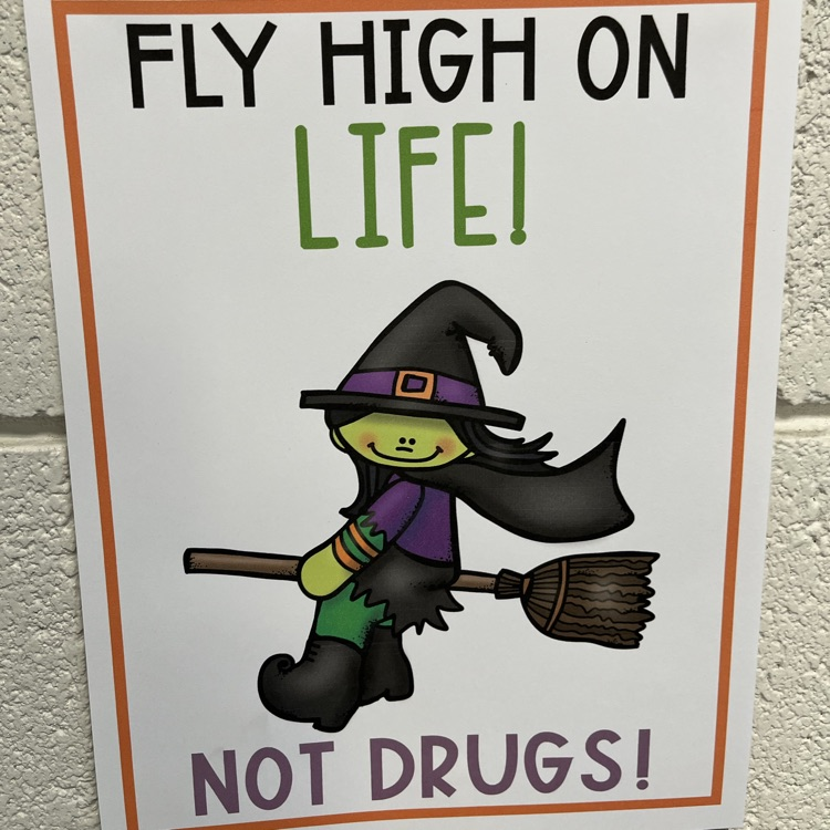 A poster displaying a witch and the words “Fly high on life,  it on drugs"