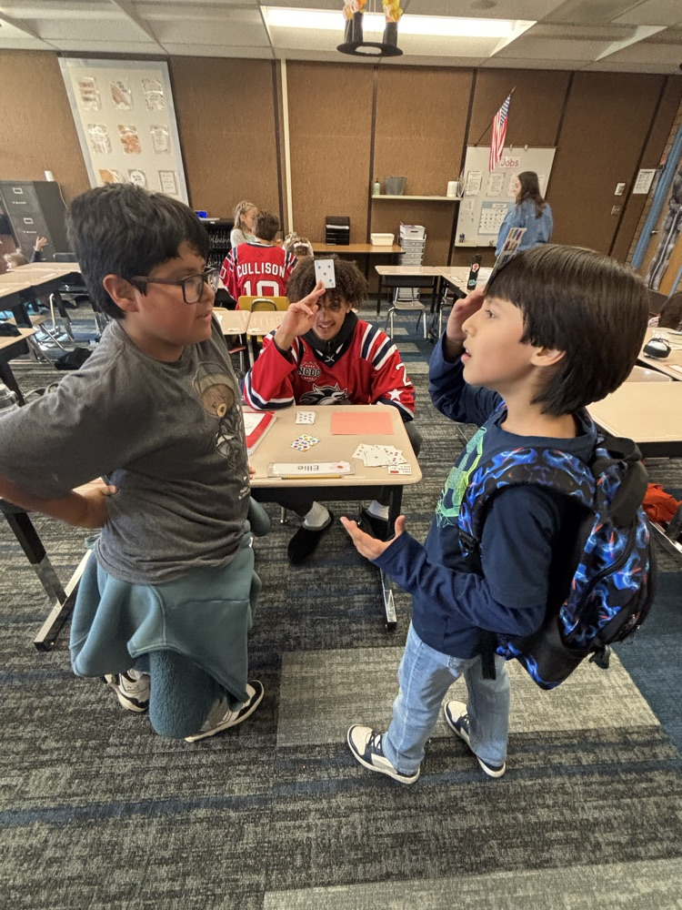 students playing math games with Ogden Mustang hockey team.