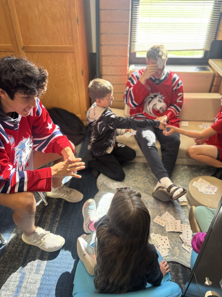 students playing math games with Ogden Mustang hockey team.