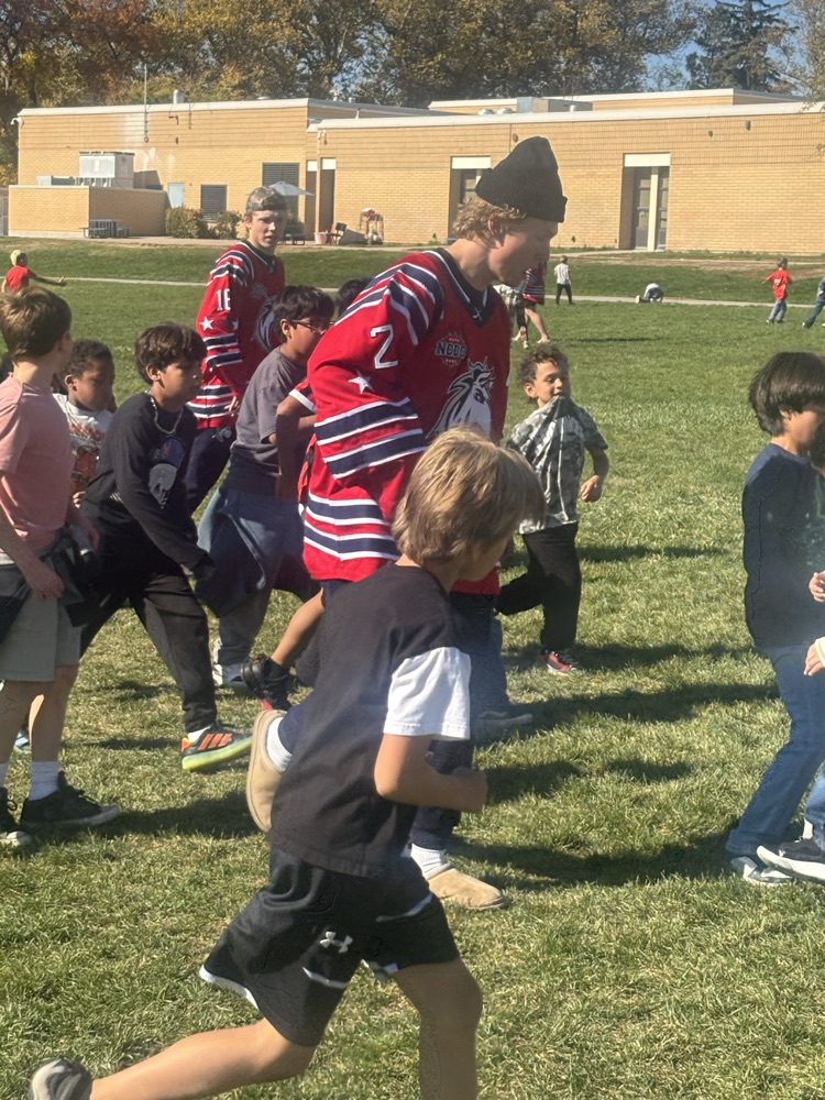 students playing soccer at recess with Ogden Mustang hockey team.