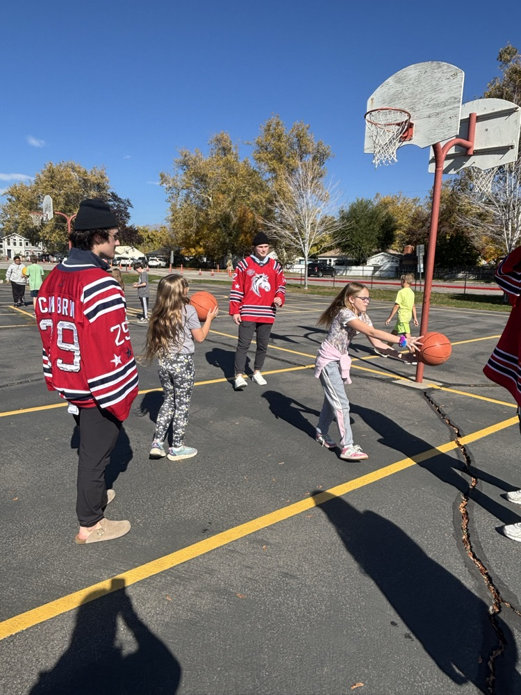 students playing basketball with Ogden Mustang hockey team.