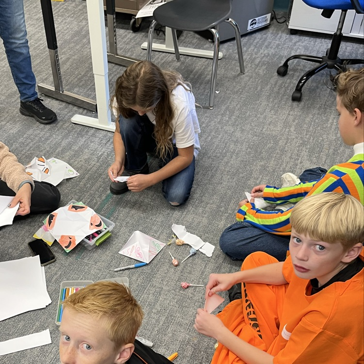 Students can be seen playing games in their class Halloween parties.
