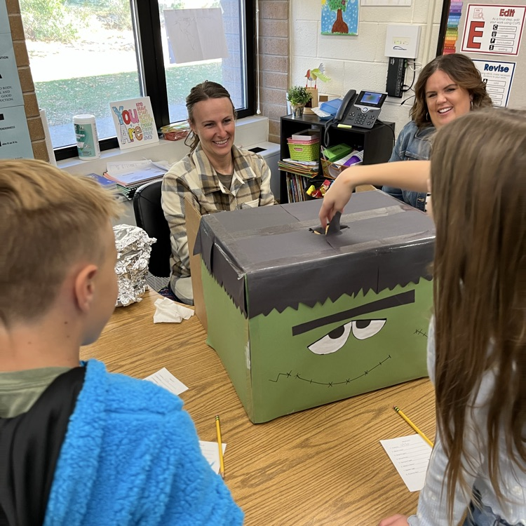Students can be seen playing games in their class Halloween parties.