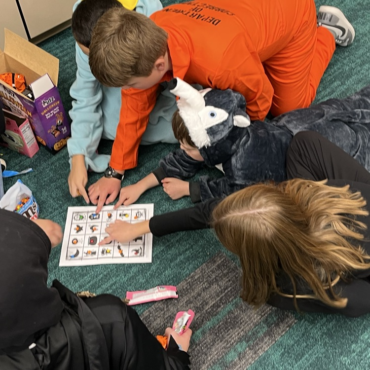 Students can be seen playing games in their class Halloween parties.