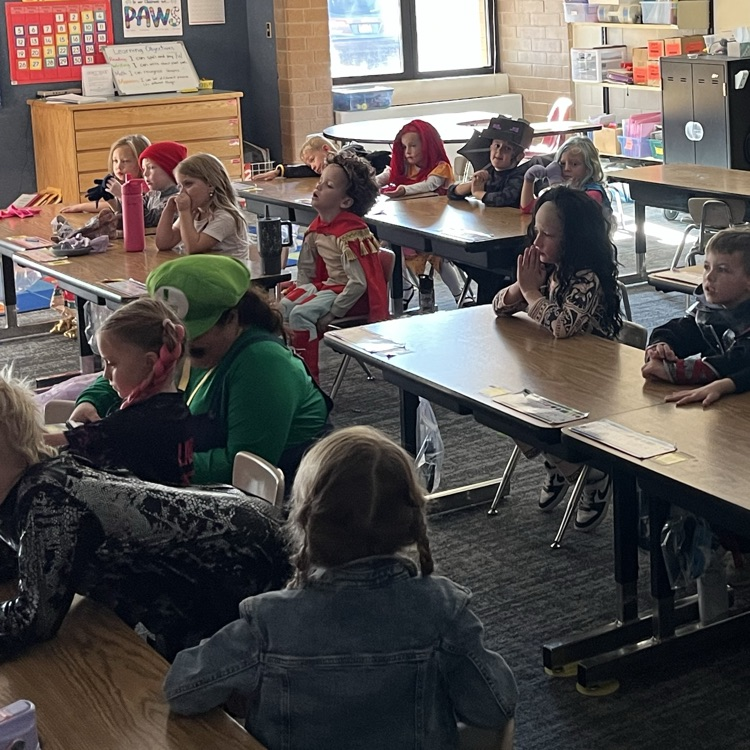 Students can be seen playing games in their class Halloween parties.