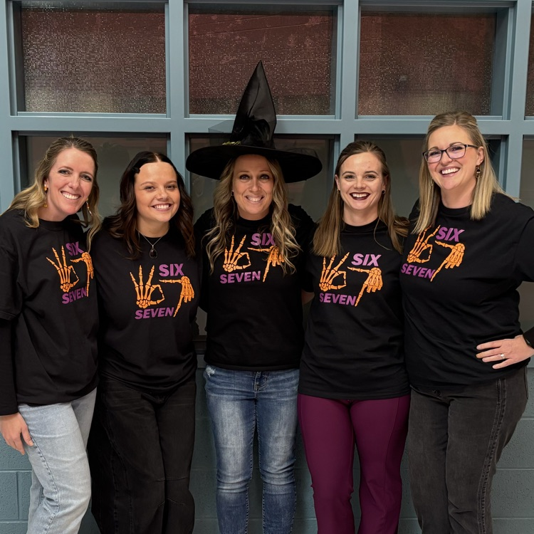 Six staff members dressed in 67 shirts