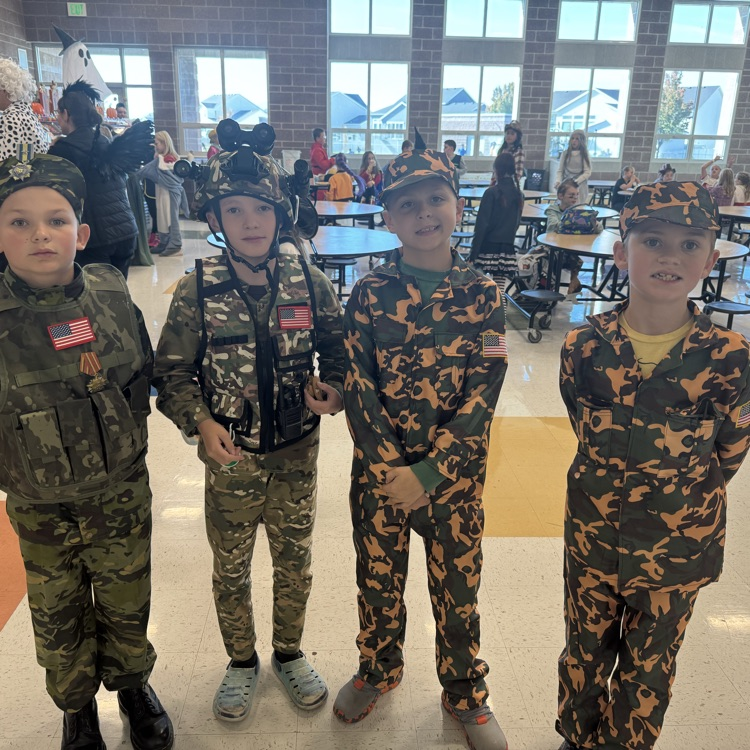 Four students dressed as army men