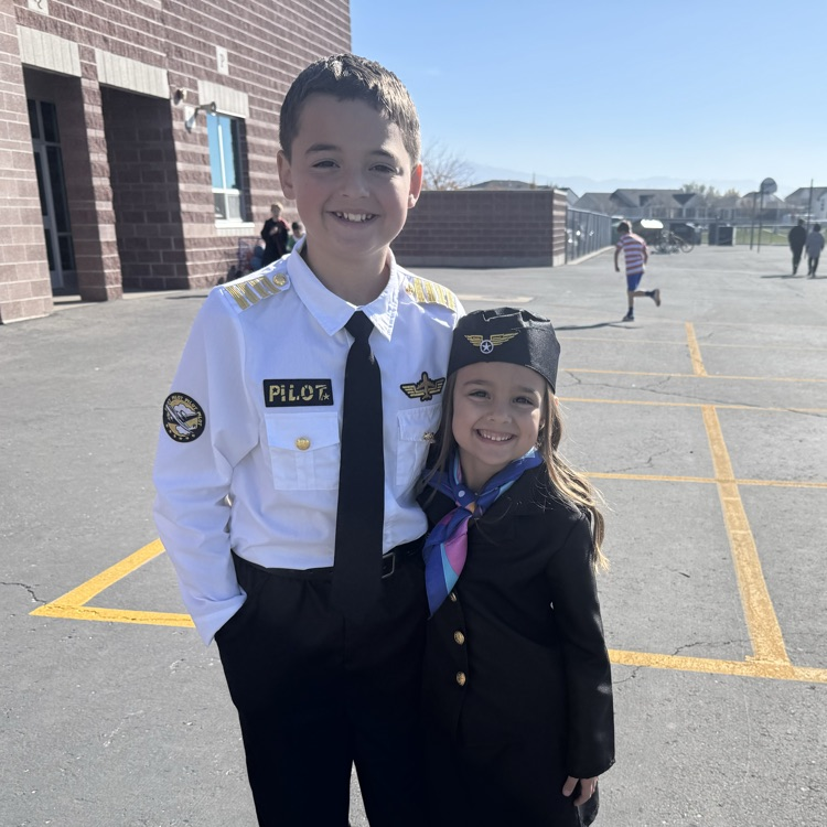 Brother and sister dressed and coordinating costumes