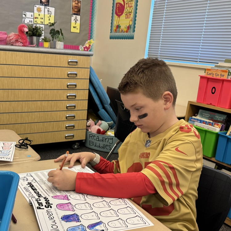 Student coloring in costume