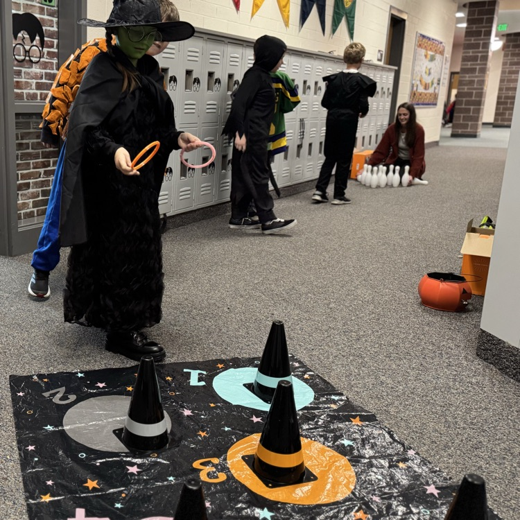 Students in costume doing ring toss