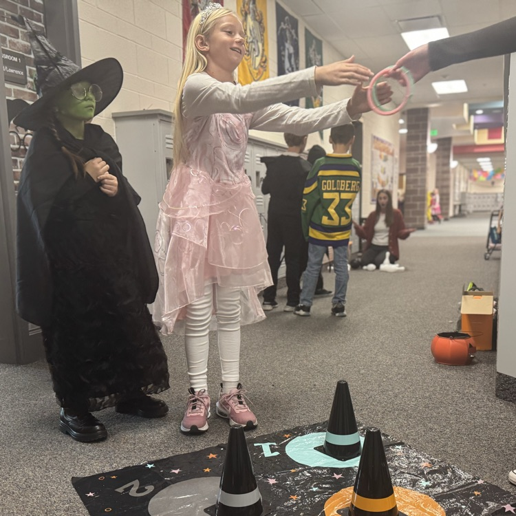 students playing ring toss at Halloween party