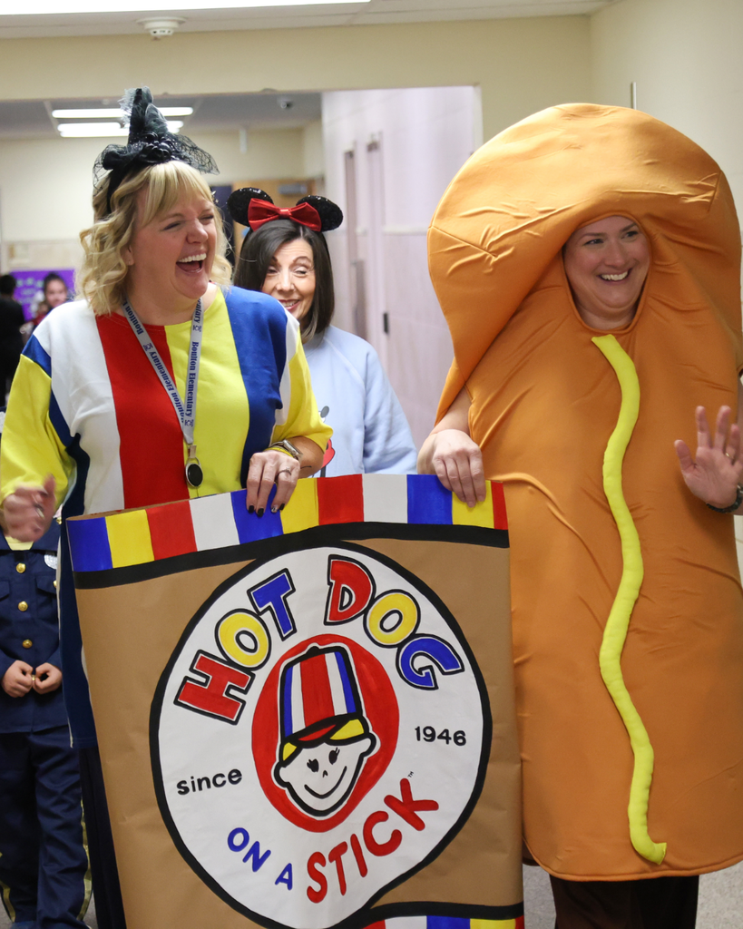 Admin wearing Halloween costumes.