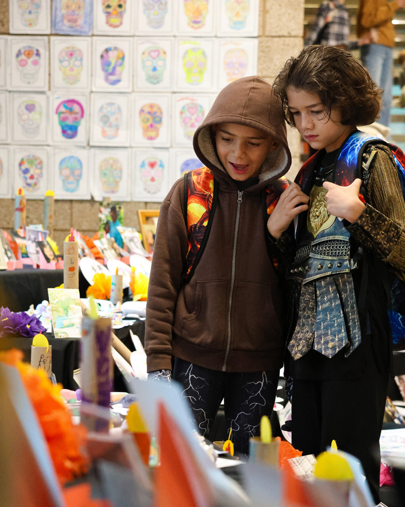 Two students admire the ofrenda at Canyon Creek Elementary.