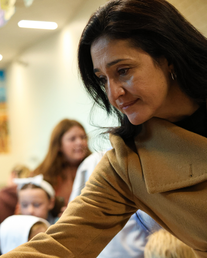 A parent admires the ofrenda at Canyon Creek Elementary.