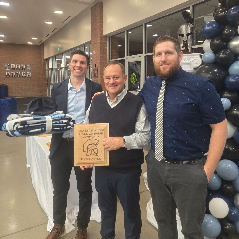 Former LHS Principal Ryck Astle posing with his Hall of Fame induction award