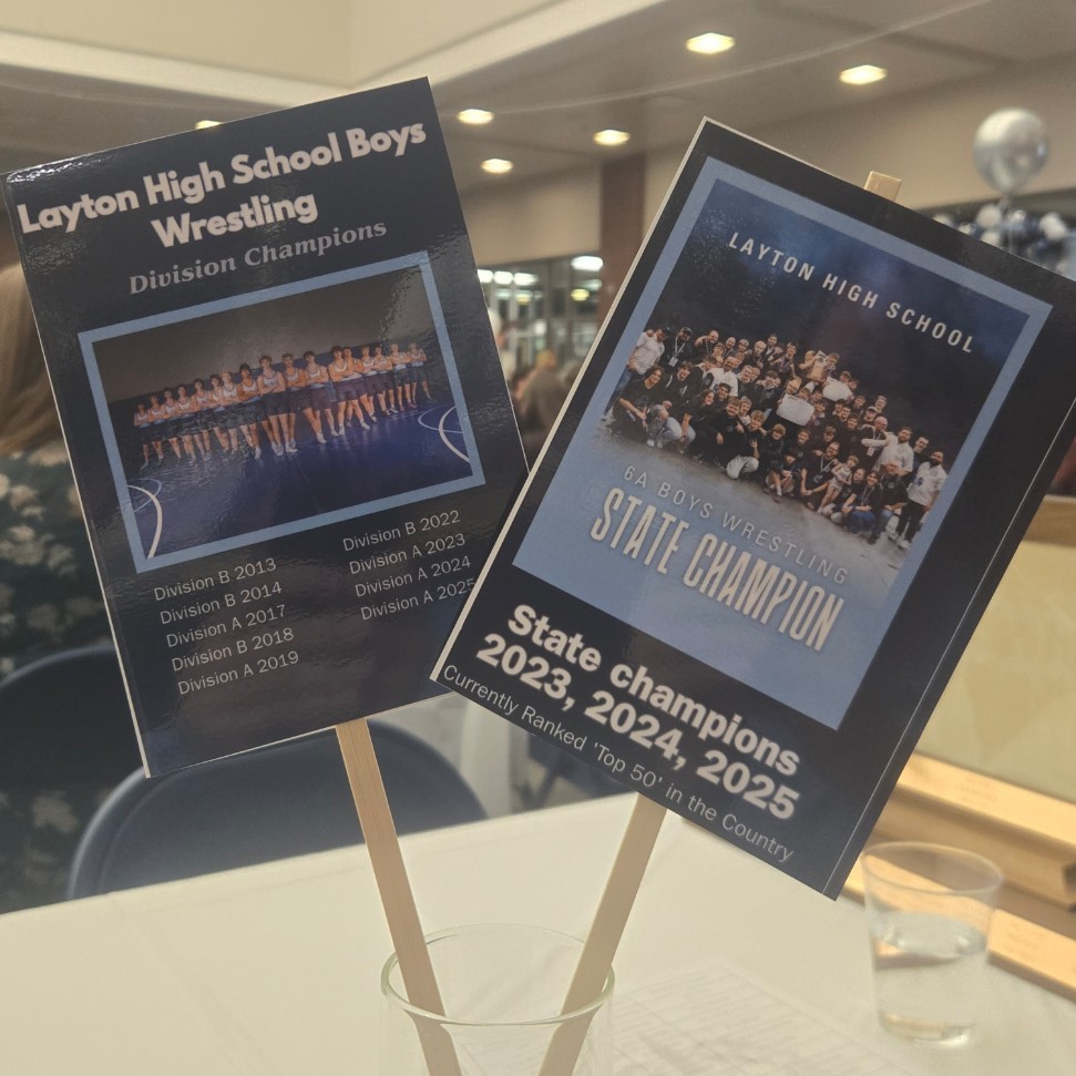 table decorations showing multiple division and state champion wrestling awards