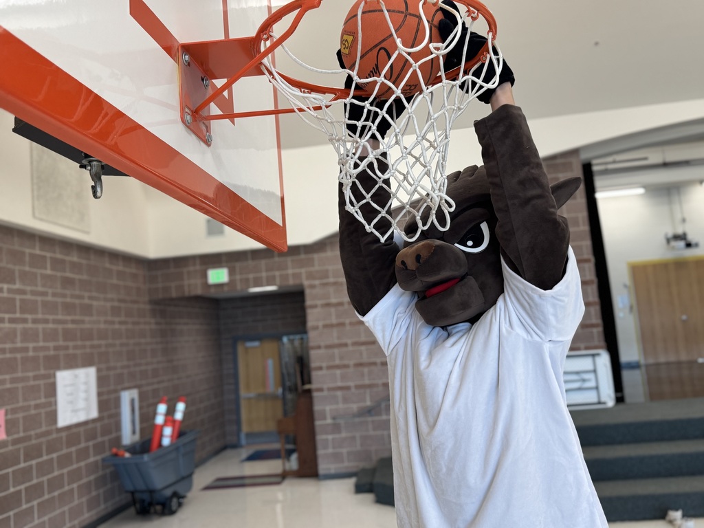 Chip the mascot slam dunking a basketball