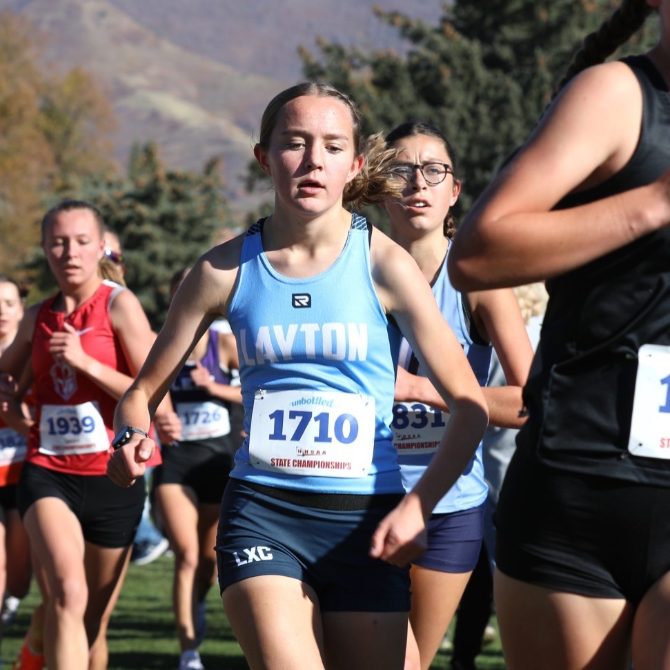 Girl cross country runner #1710 competing at state