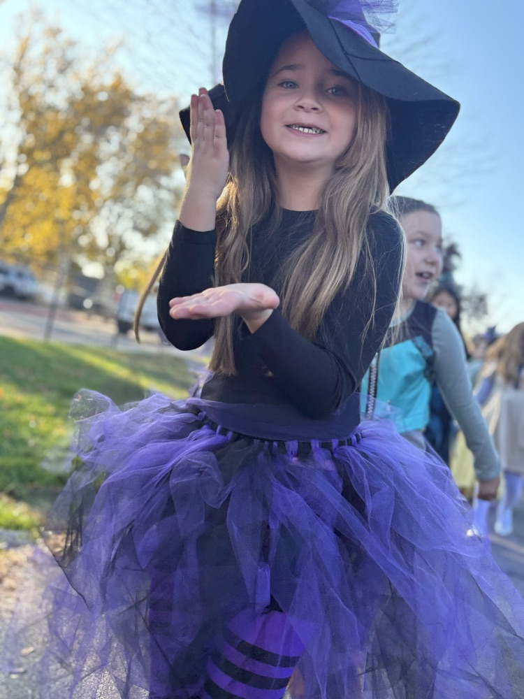 student dressed as a witch for Halloween parade.