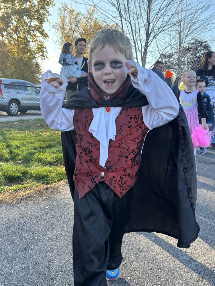 student dressed as vampire during Halloween parade.