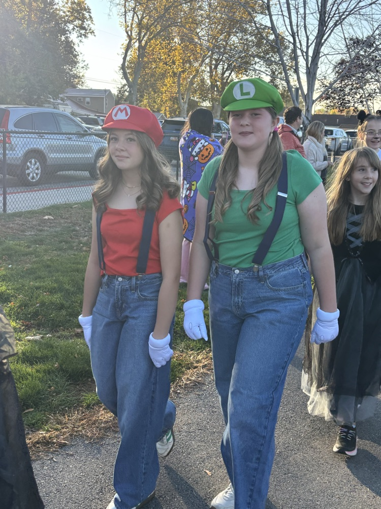 Students dressed as Mario and Luigi for Halloween parade.