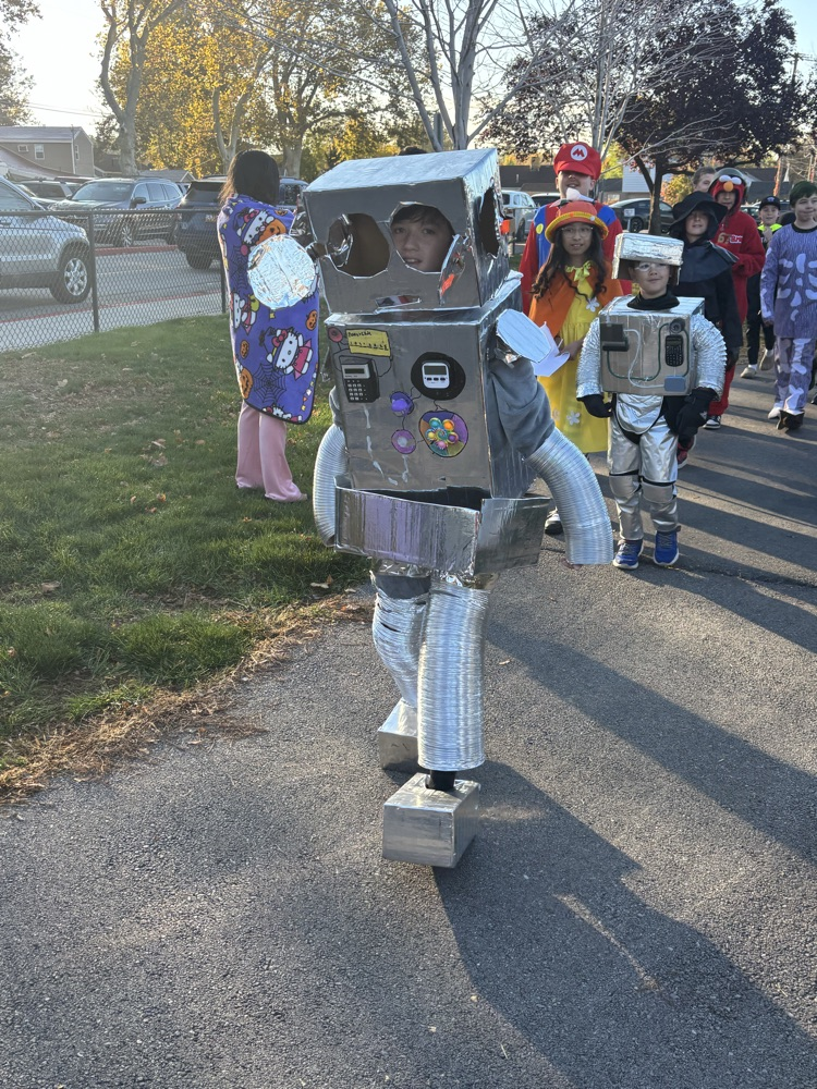 student dressed as robot for Halloween parade.
