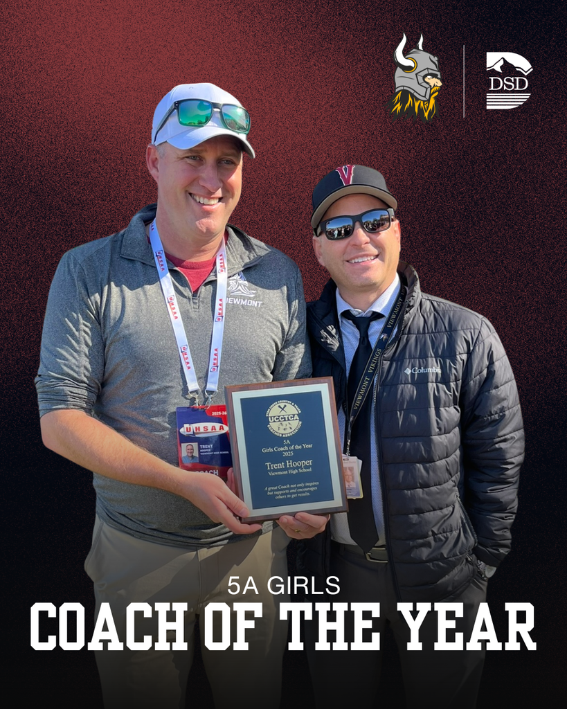 A photo of a coach and principal Travis Lund. The coach is holding a plaque. There are words that read 5A Girls Coach of the Year. 