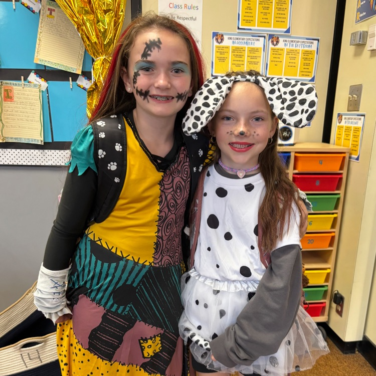 students posing in costumes for Halloween 