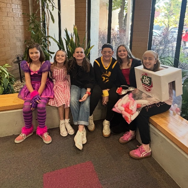 students posing in costumes for Halloween 