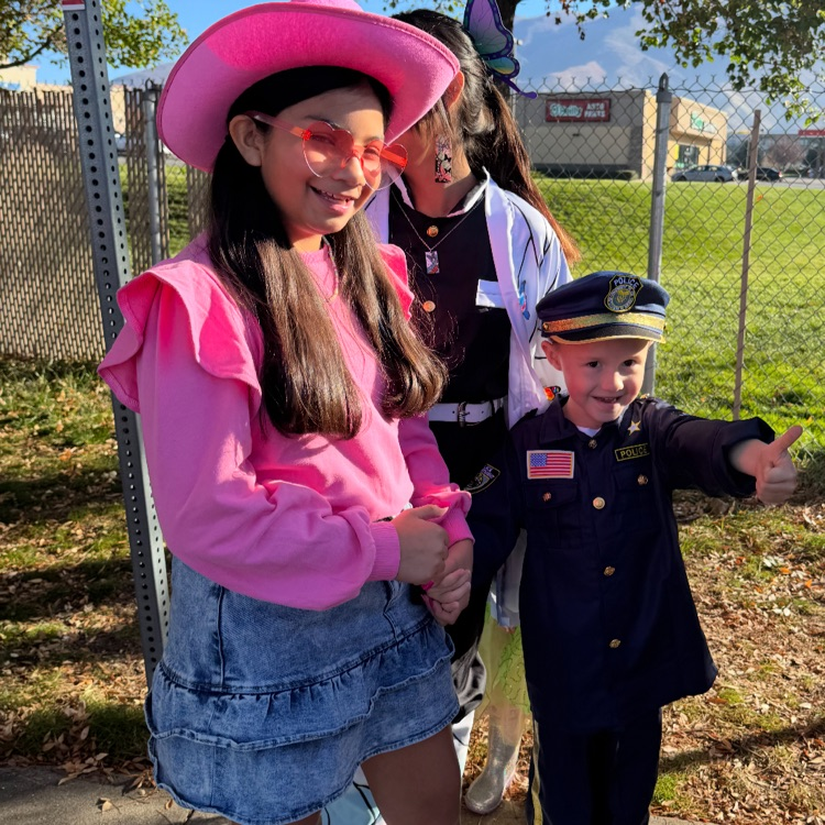 students posing in costumes for Halloween - ready for a walking field trip 