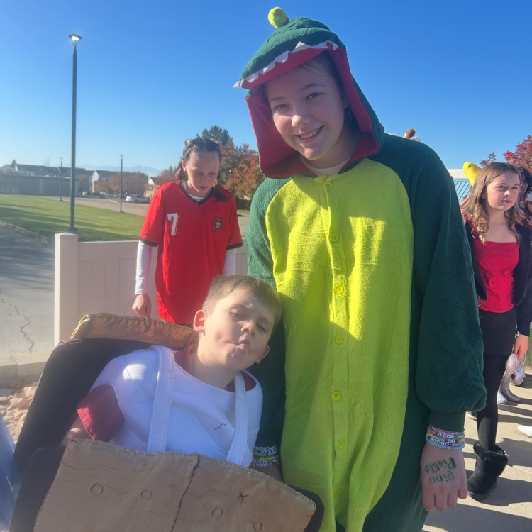 students posing in costumes for Halloween - ready for a walking field trip 