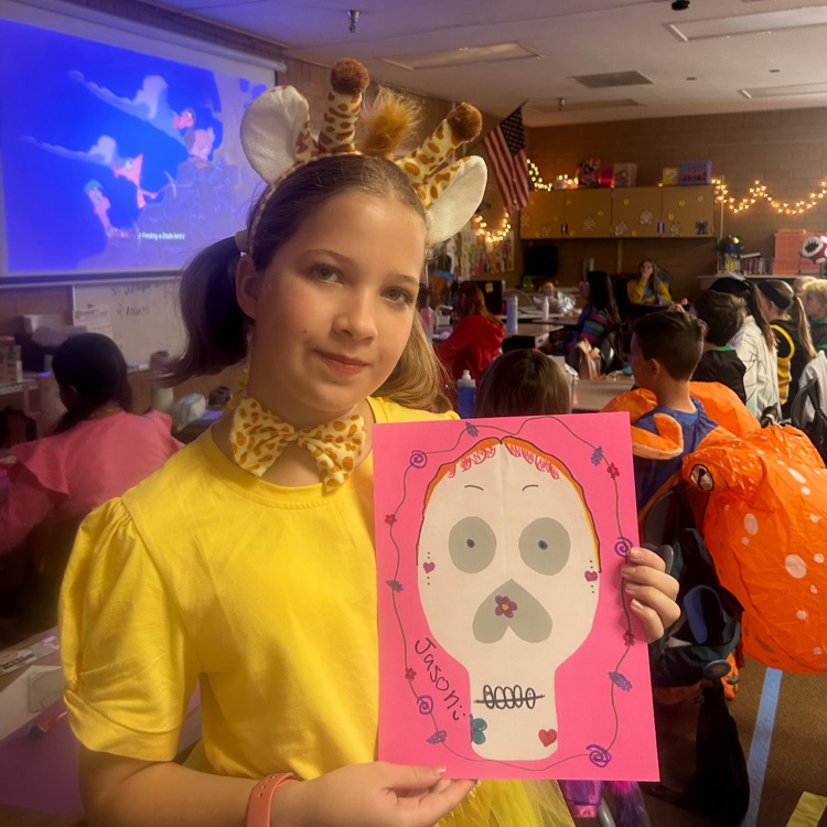 students posing in costumes for Halloween 