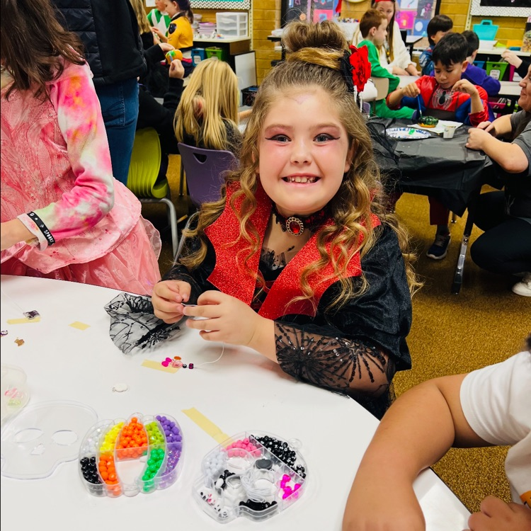 students posing in costumes for Halloween 