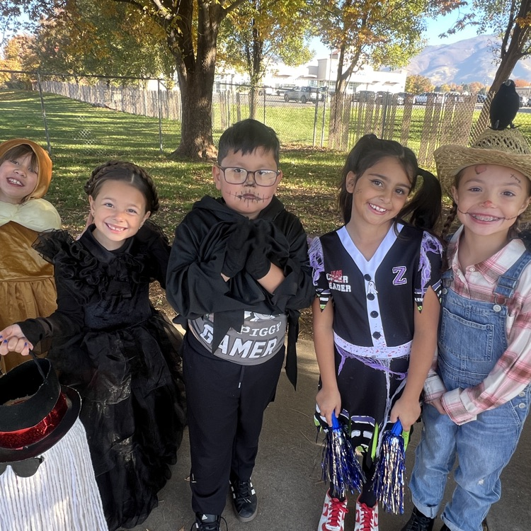 students posing in costumes for Halloween - ready for a walking field trip 