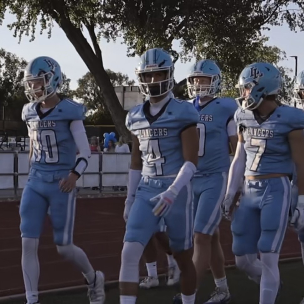 Football players walking out at the start of a game