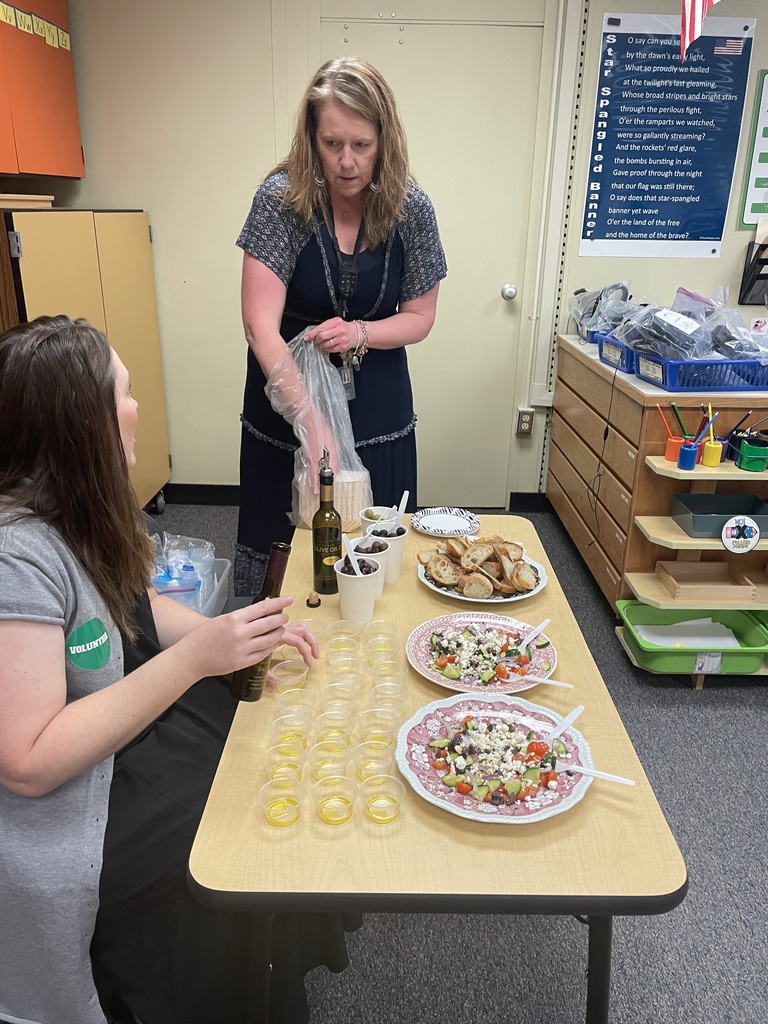 Mrs. Coulliette preparing the olive oil and snack tasting treats
